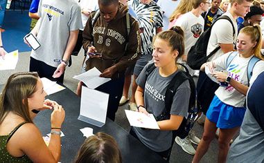 Students line up to get information during Academic Day.