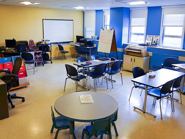 Tables for both adult and children and technology equipment fills the CATE lab