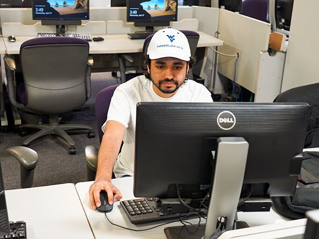 A student uses the computer lab to complete assignments